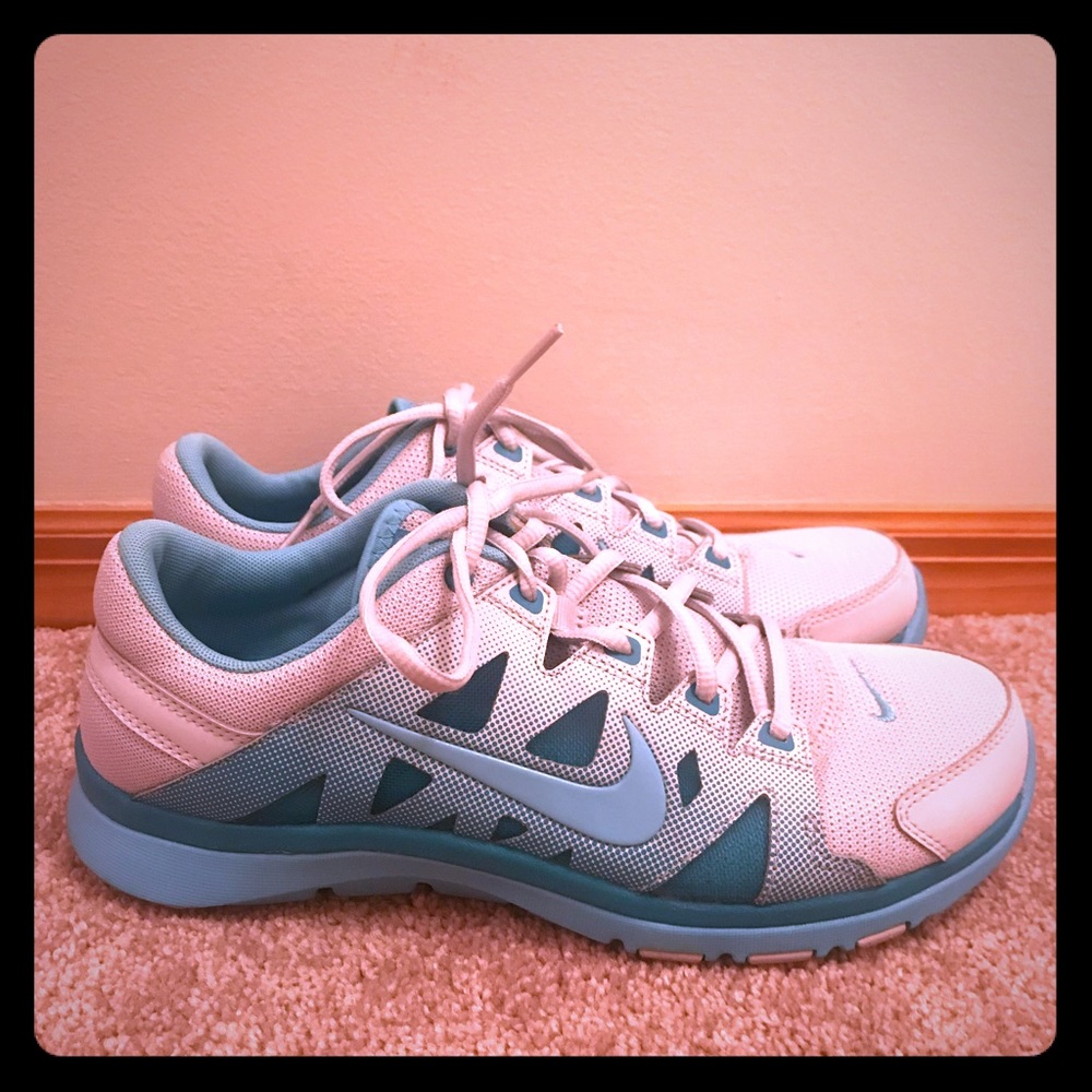Blue and white nike running shoes